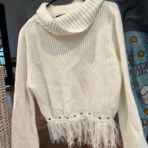 Turtleneck sweater with fringe